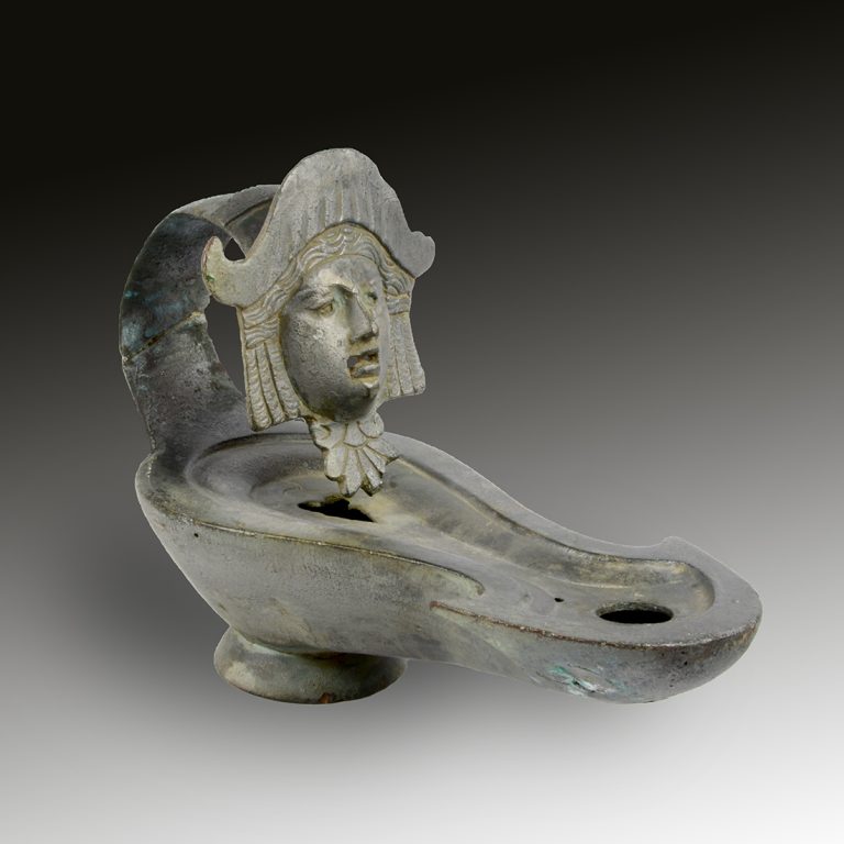 A Roman oil lamp with a Medusa head